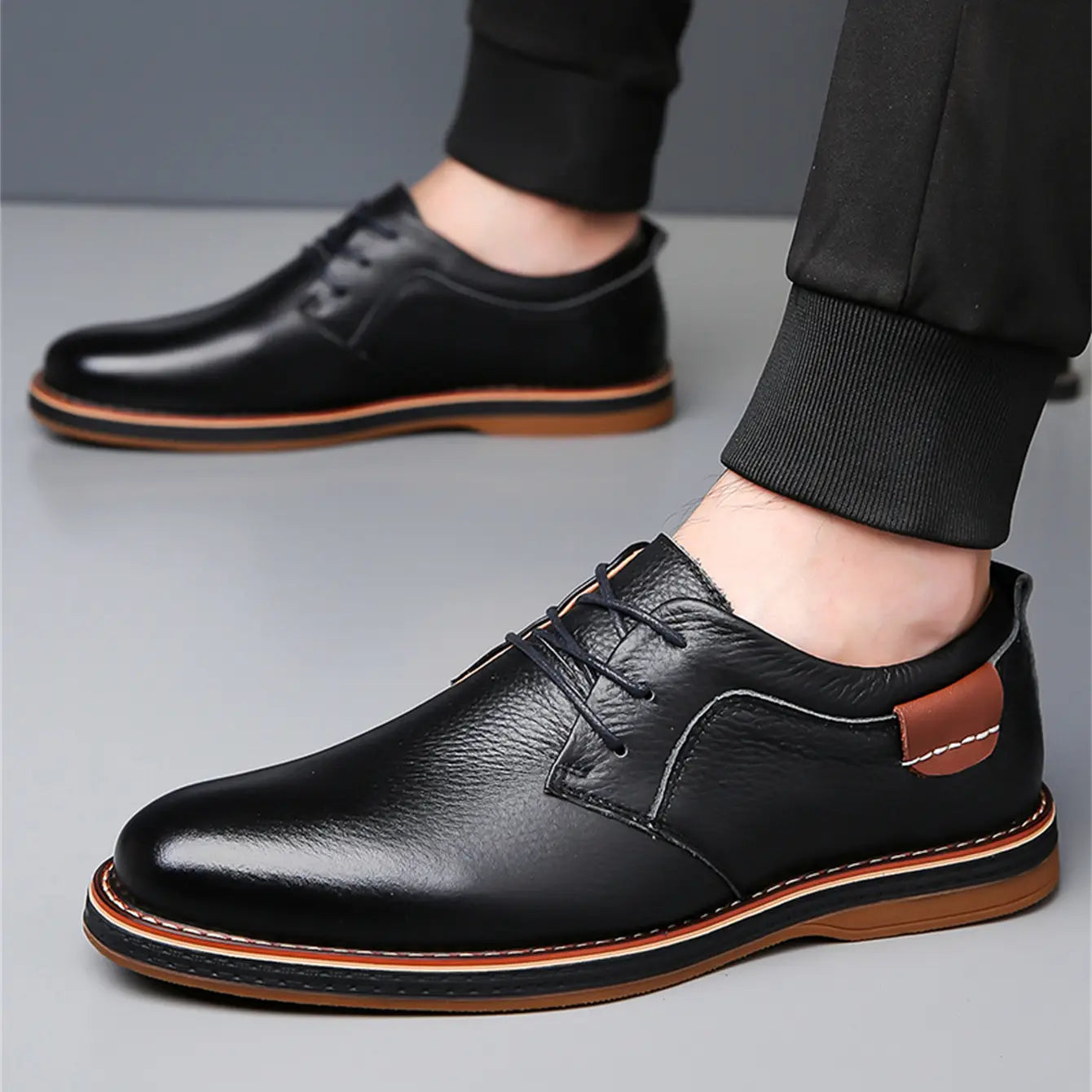 men’s handmade genuine leather lace up oxford shoes in black leather with brown rubber sole and contrasting tan stitching.