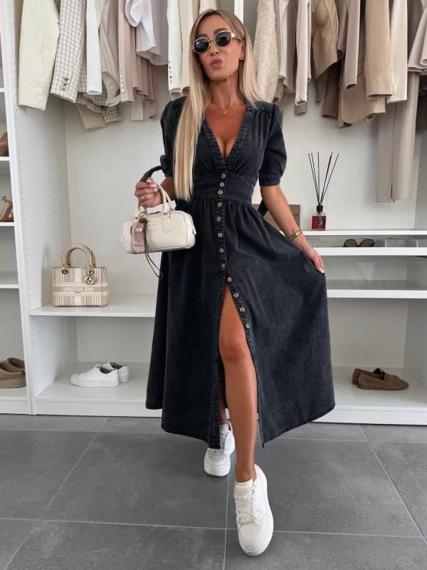 black denim midi dress with button front, puff sleeves, and high slit in a casual yet stylish design