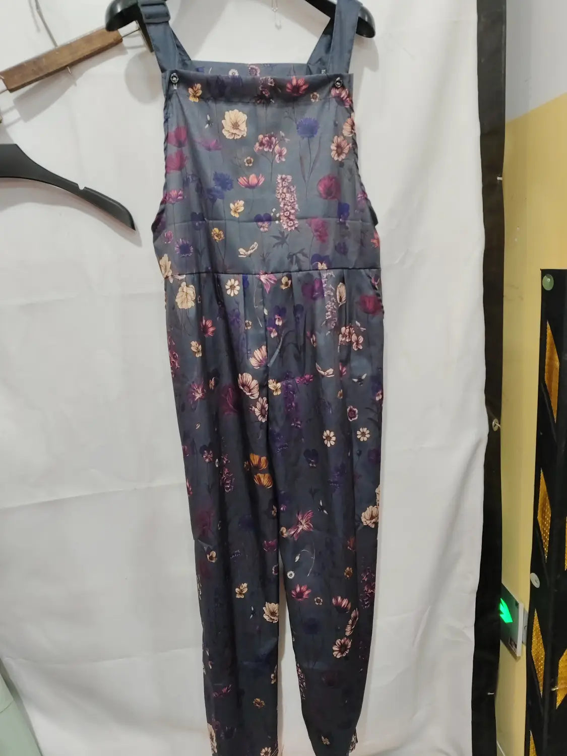 printed suspender overalls casual pants in dark gray denim with a floral pattern featuring pink purple and yellow flowers