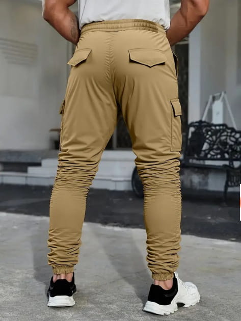 Men’s slim fit cropped tan cargo joggers with multiple pockets ribbed cuffs and drawstring waist.