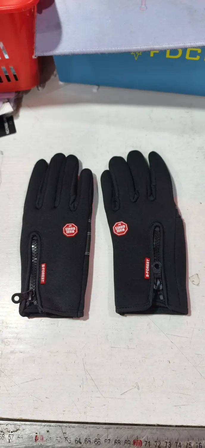 Black windproof touchscreen winter gloves with red zipper pulls and a circular logo on the back side suitable for men and women.