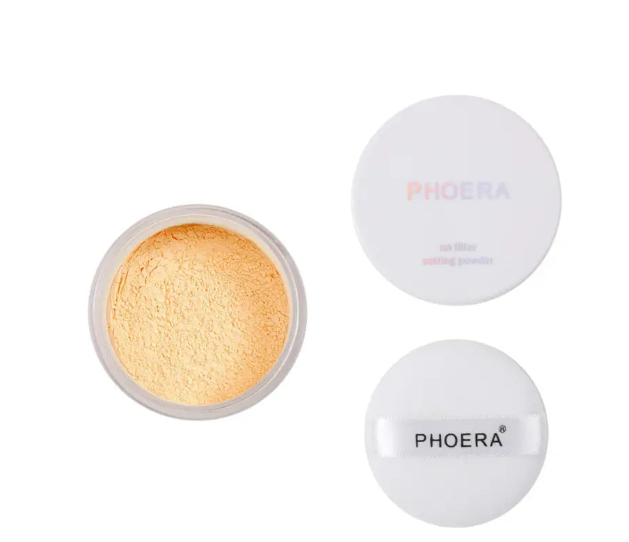 White circular container of Phoera setting powder with a translucent lid containing golden-yellow loose powder for oil control matte finish in four shades.