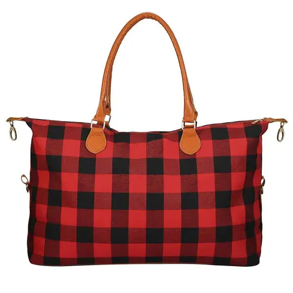 Large capacity cotton canvas weekend travel duffle bag in red and black plaid with tan leather handles.