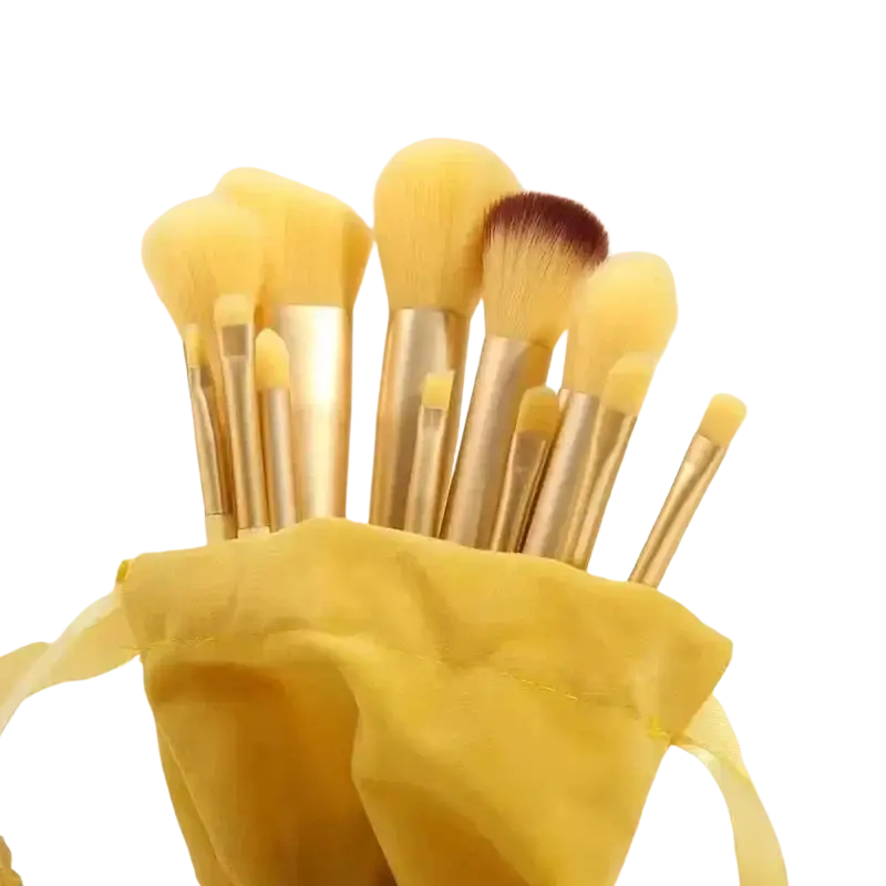 33-piece makeup brush and sponge set with nylon brush material featuring soft pale yellow bristles and gold handles in pouch