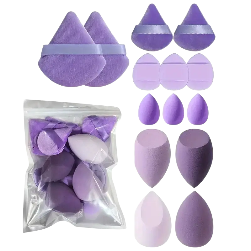 A set of lavender and light purple makeup sponges in teardrop cone and oval shapes included in 33-piece brush set with nylon bristles