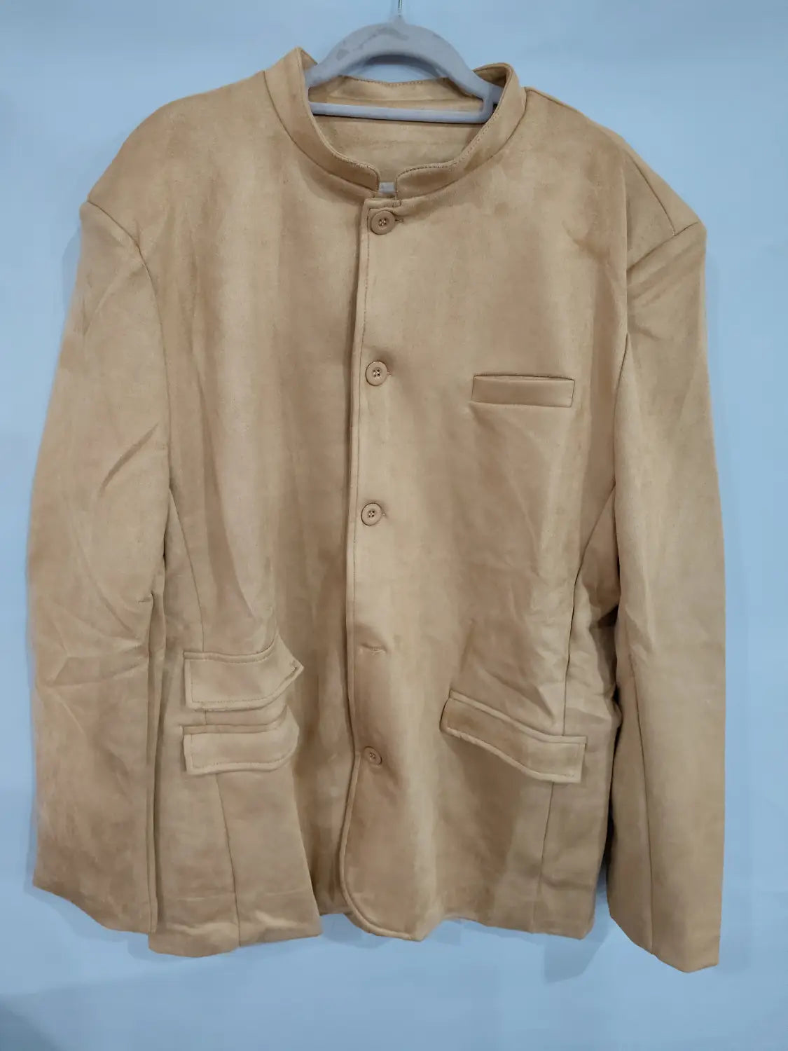 Men’s brown suede business casual blazer jacket in beige suede with mandarin collar and front button closure.