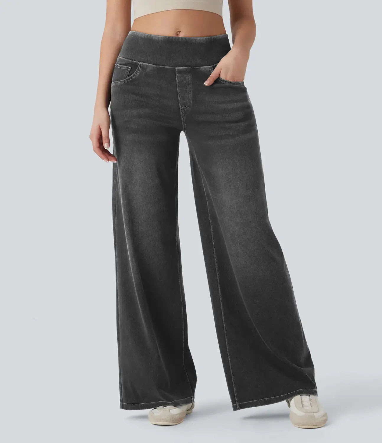Dark gray wide leg stretchy high waisted denim jeans with subtle fading and a high waist.