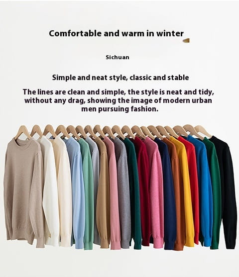 Una fila de suéteres tipo pulóver de cuello redondo acanalado para hombre en colores sólidos, de beige a negro, colgados de forma ordenada, que muestran mangas largas y material de punto suave.