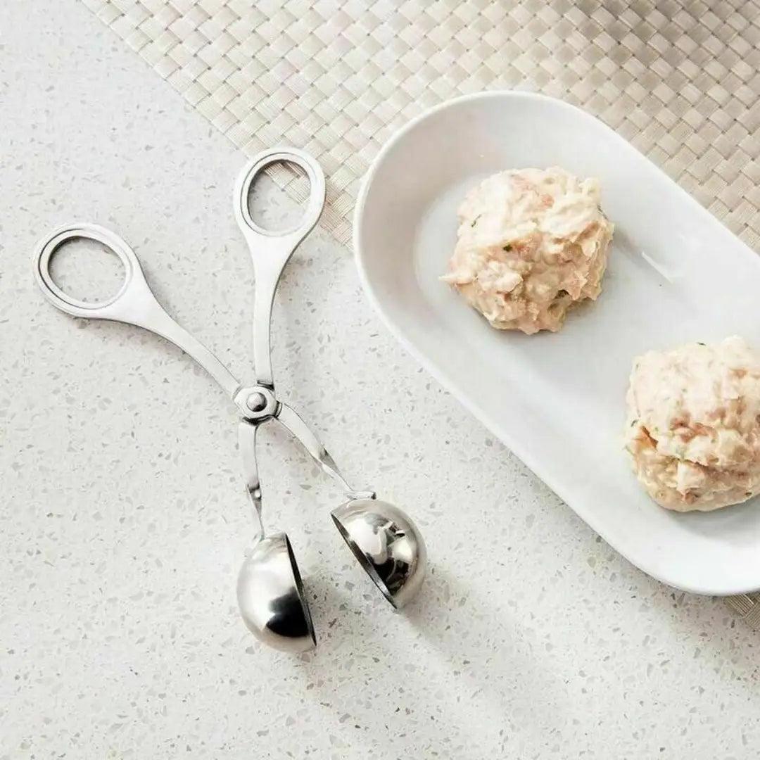 Stainless steel meatball maker tongs kitchen baller scoop featuring a sleek polished finish and ergonomic handles for comfortable use.