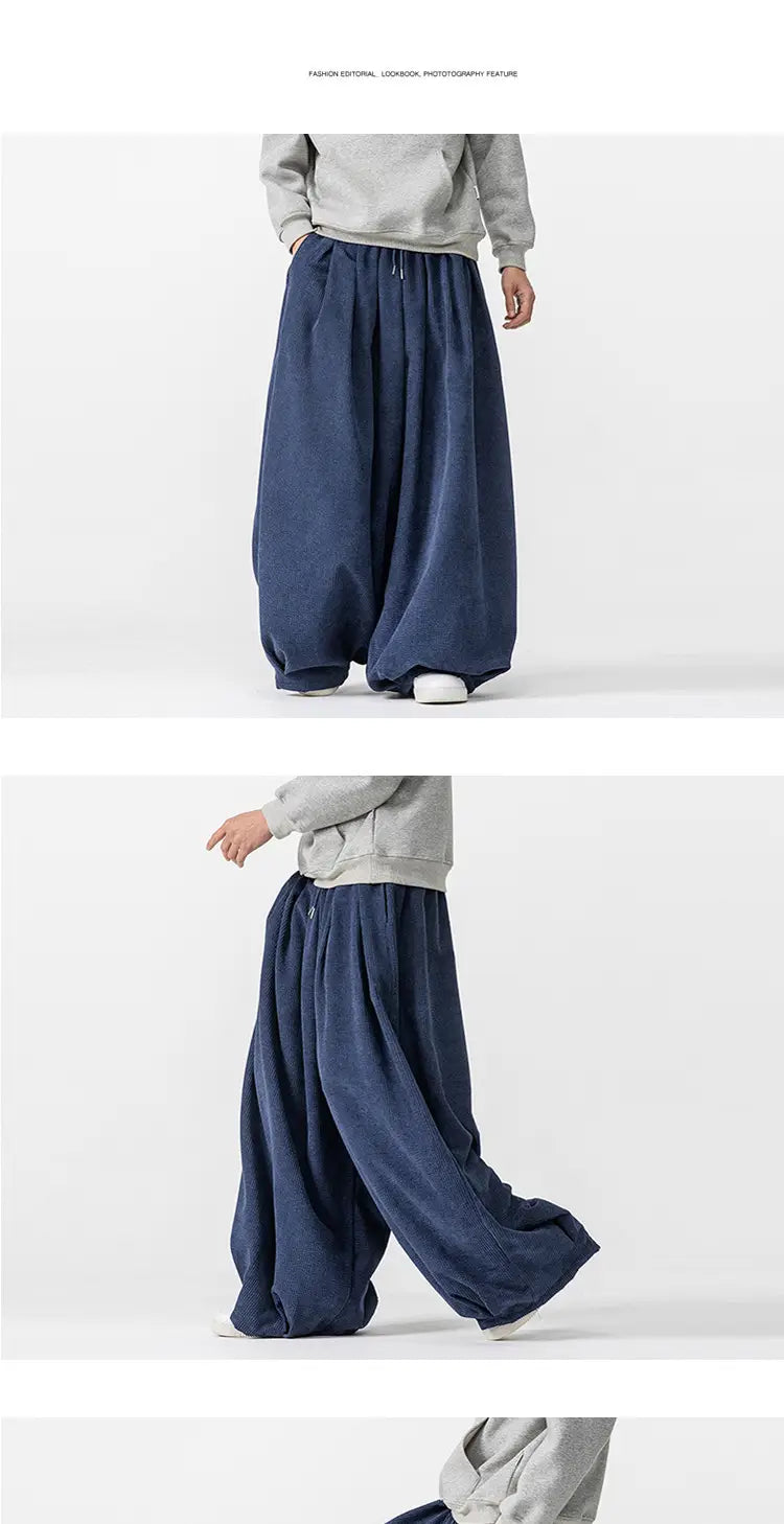 Pantalon en velours côtelé bleu marine foncé à jambes larges pour hommes, en tissu de coton ample et à ceinture élastique.