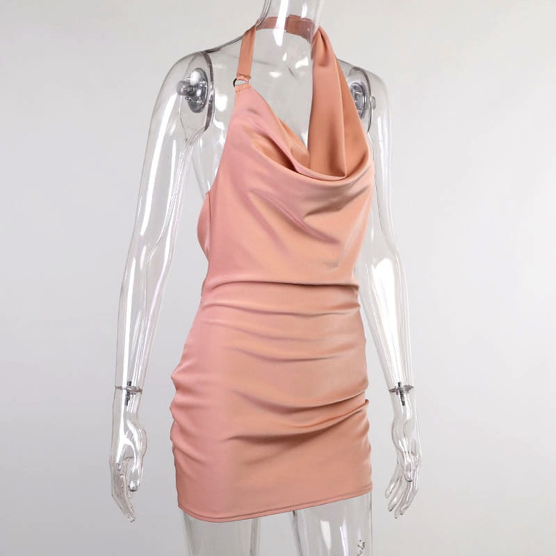 A sleek blush-pink satin halter mini party dress with a draped cowl neckline and ruched detailing.