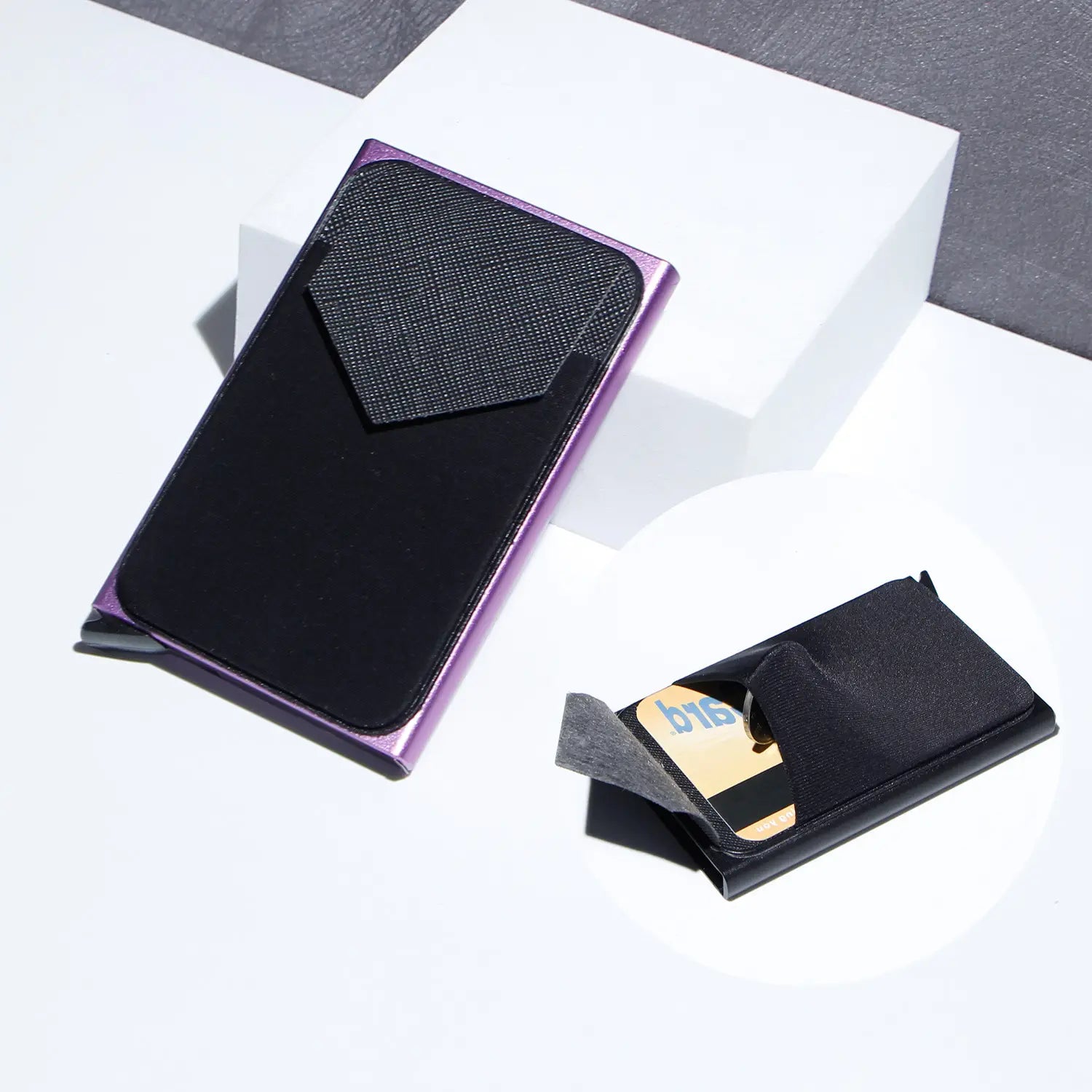 Minimalist rfid blocking aluminum multi card wallet in purple and black metallic with a textured flap.