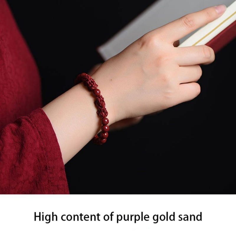 red beaded bracelet with intricate woven design featuring hand carved purple gold cinnabar double pixiu accents