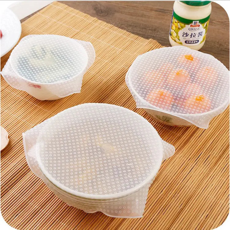 Couvercles extensibles en silicone transparent, réutilisables pour la conservation des aliments, lot de 4, avec une texture à points conçue pour s’ajuster au-dessus des bols et des assiettes.