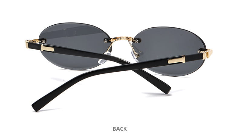 Frameless oval UV400 fashion sunglasses with black frames, gold-tone metal accents, and dark gray lenses.