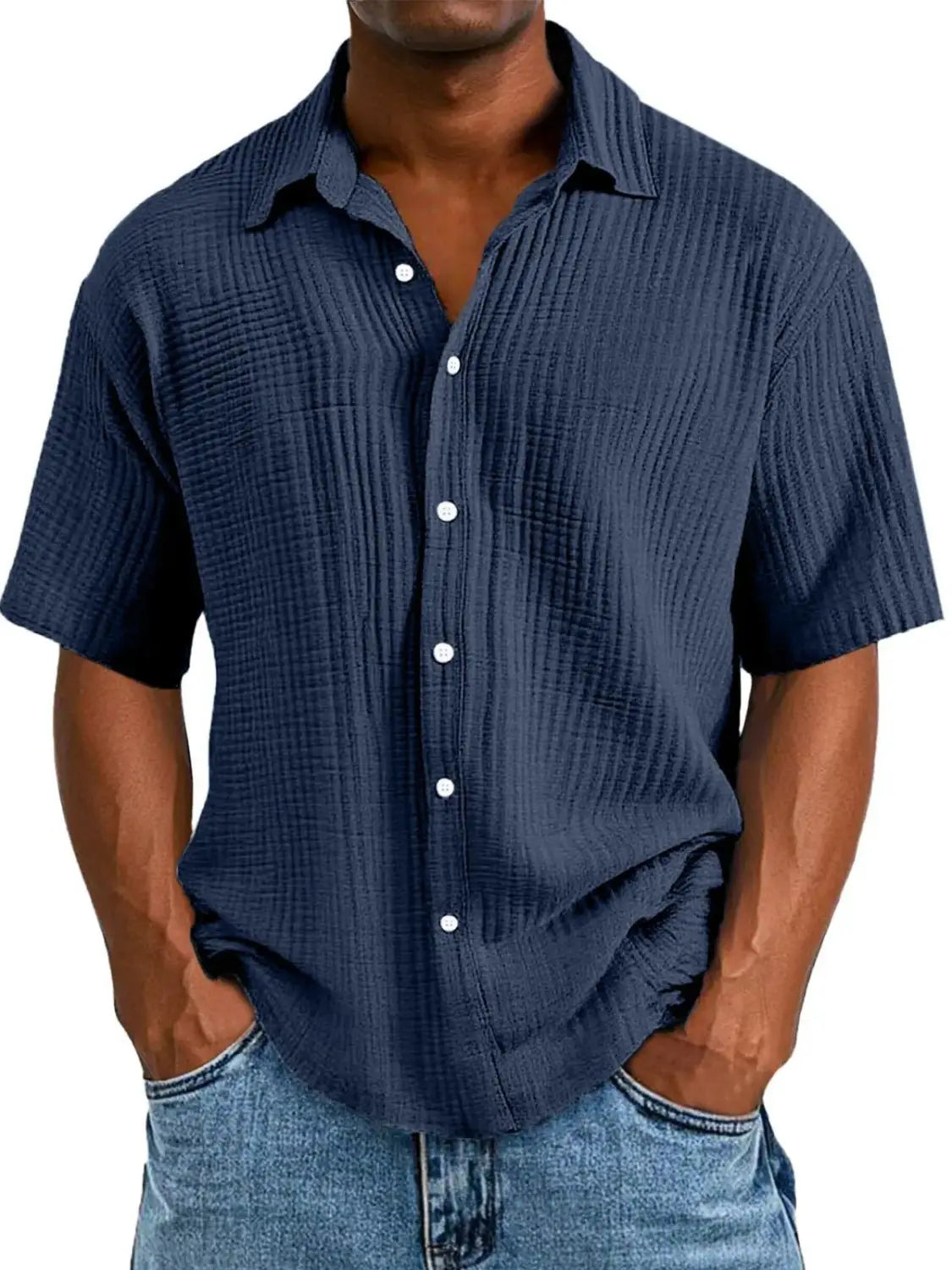Men’s textured short sleeve button up shirt in navy blue with ribbed fabric and white buttons.