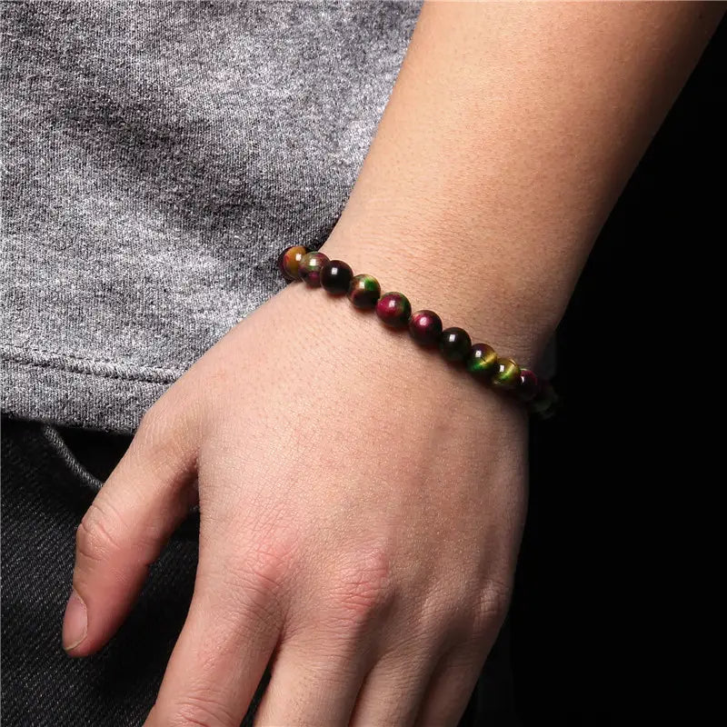 Men’s 8mm natural tiger eye and gemstone bead bracelet featuring colorful polished beads with natural banding in shades of brown green gold and red.
