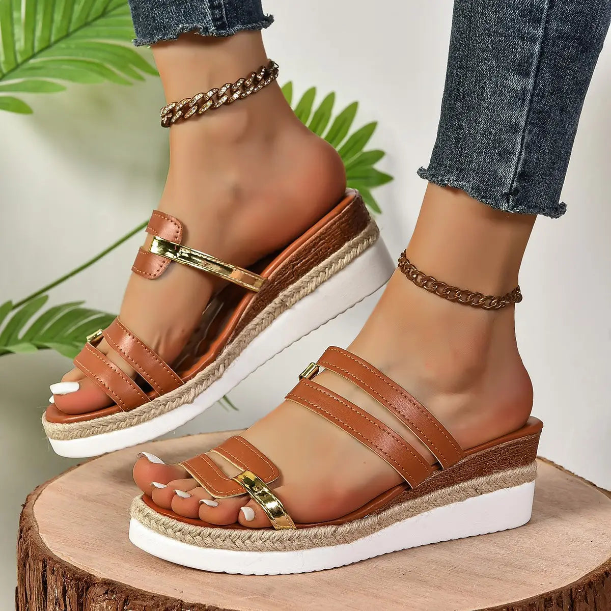 brown leather wedge sandals with espadrille heel and gold-tone metal accents featuring a white rubber sole