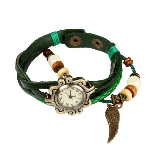 Bohemian green braided leather angel wing watch featuring a vintage-style silver-toned case with wooden and white beads and a bronze angel wing charm.