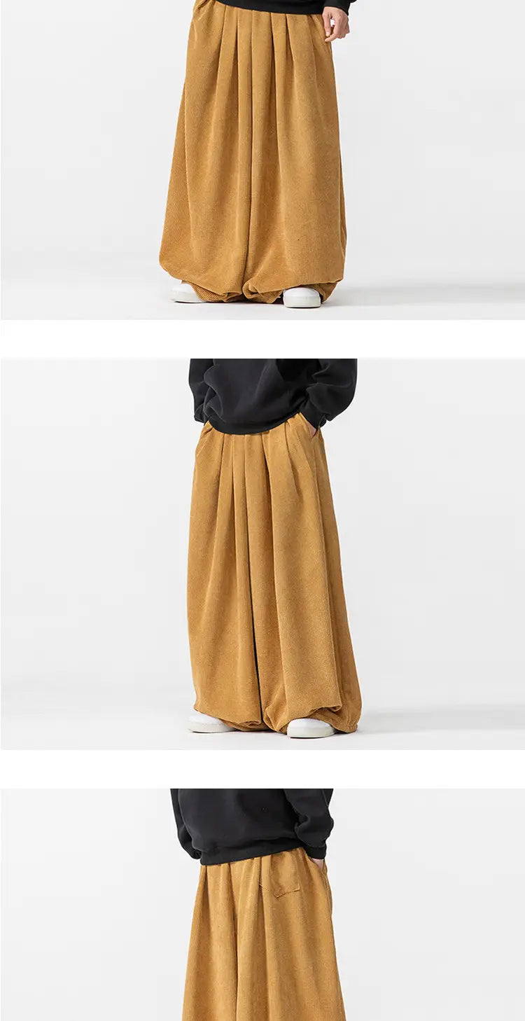 Pantalon en velours côtelé à jambes larges pour hommes en tissu camel en coton lin ample, avec une tenue particulièrement marquée.