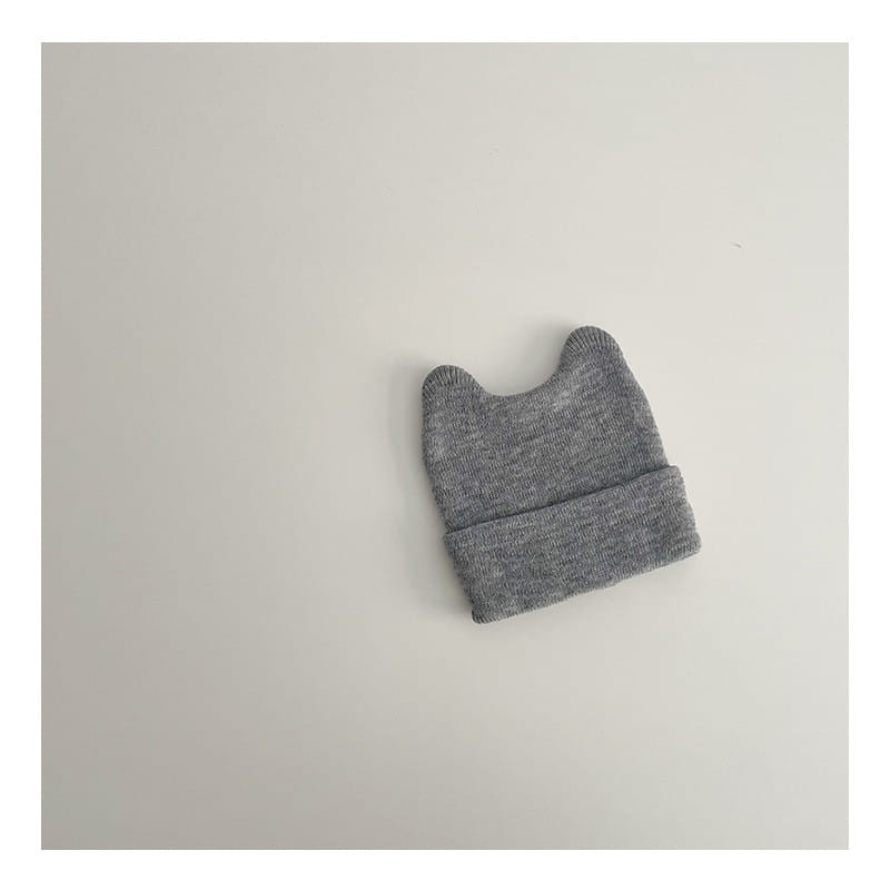 Childrens knitted beanie hat warm winter cap in gray with soft textured fabric and two rounded ear-like protrusions.