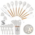 White silicone cooking utensils with wooden handles arranged around a white kitchen set storage container