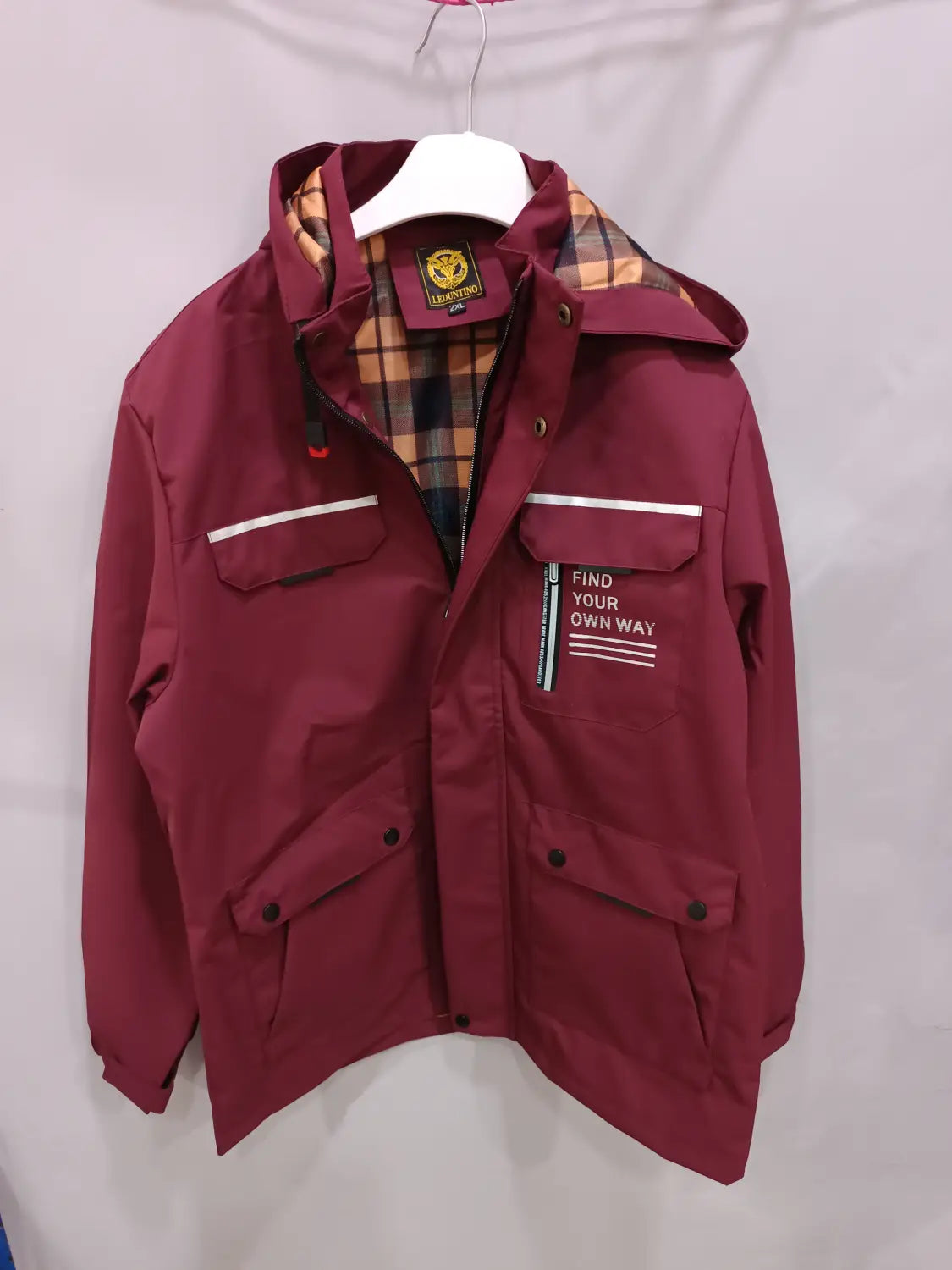 Men winter hooded parka coat in maroon waterproof material with plaid lining and white stripe accents.