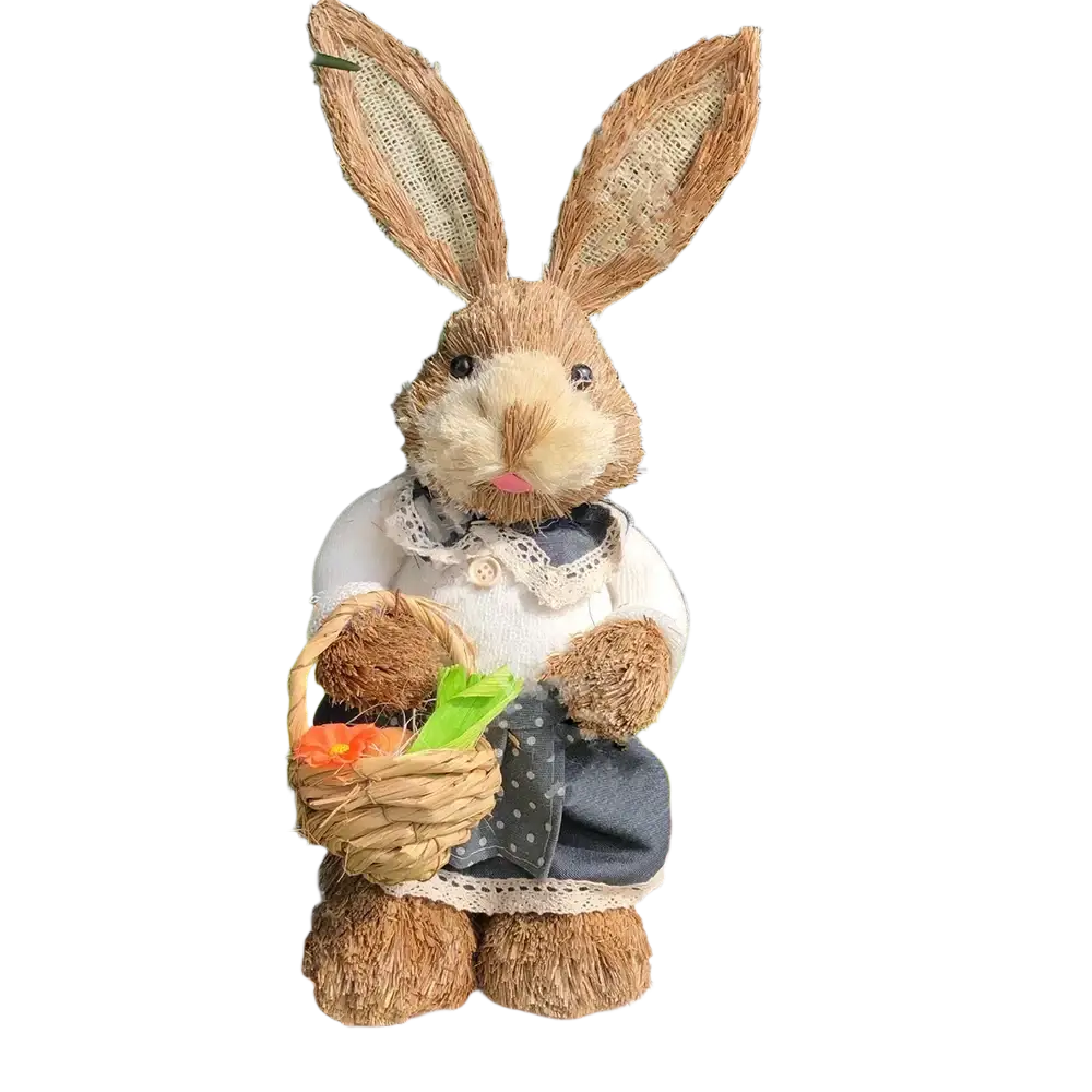 A rustic brown straw Easter rabbit figurine with woven ears dressed in a white sweater and blue polka-dot skirt