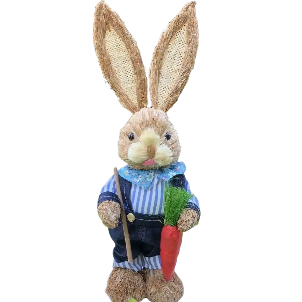 A 35cm rustic straw easter rabbit figurine in blue and white striped overalls holding a shovel and a red carrot
