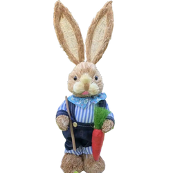 A 35cm rustic straw easter rabbit figurine in blue and white striped overalls holding a shovel and a red carrot