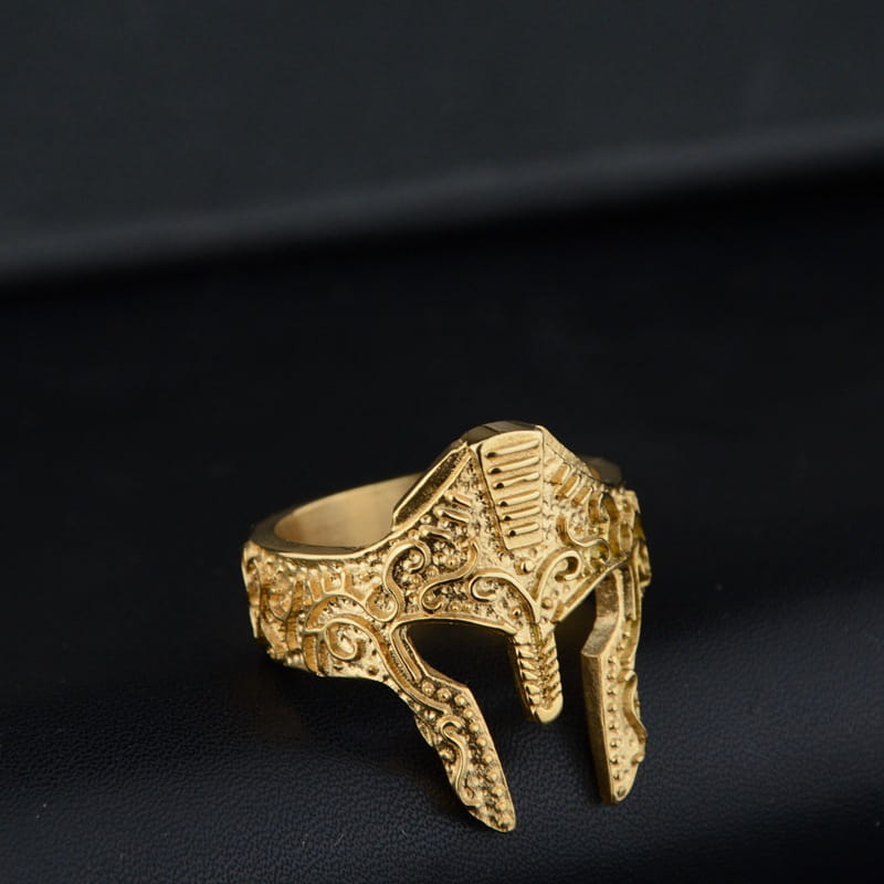 Gold-plated stainless steel spartan warrior helmet ring with intricate engraved detailing and bold design.