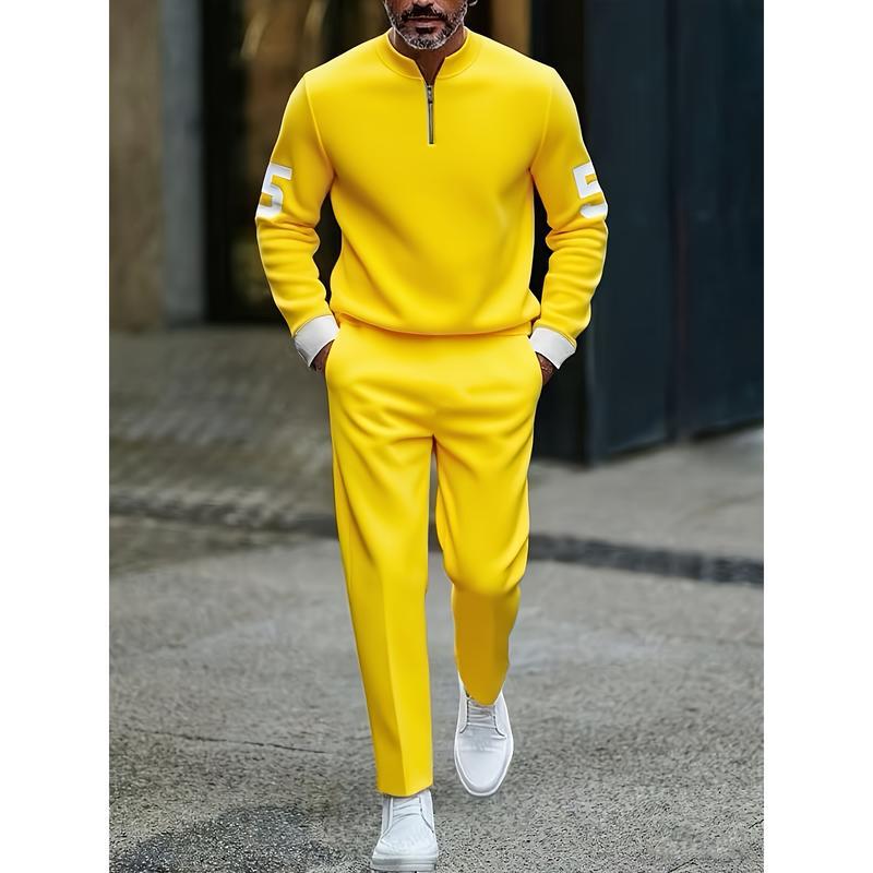 Bright yellow half zip athletic sweatsuit printed set with white numerals on the sleeves and matching pants designed for comfortable sportswear.