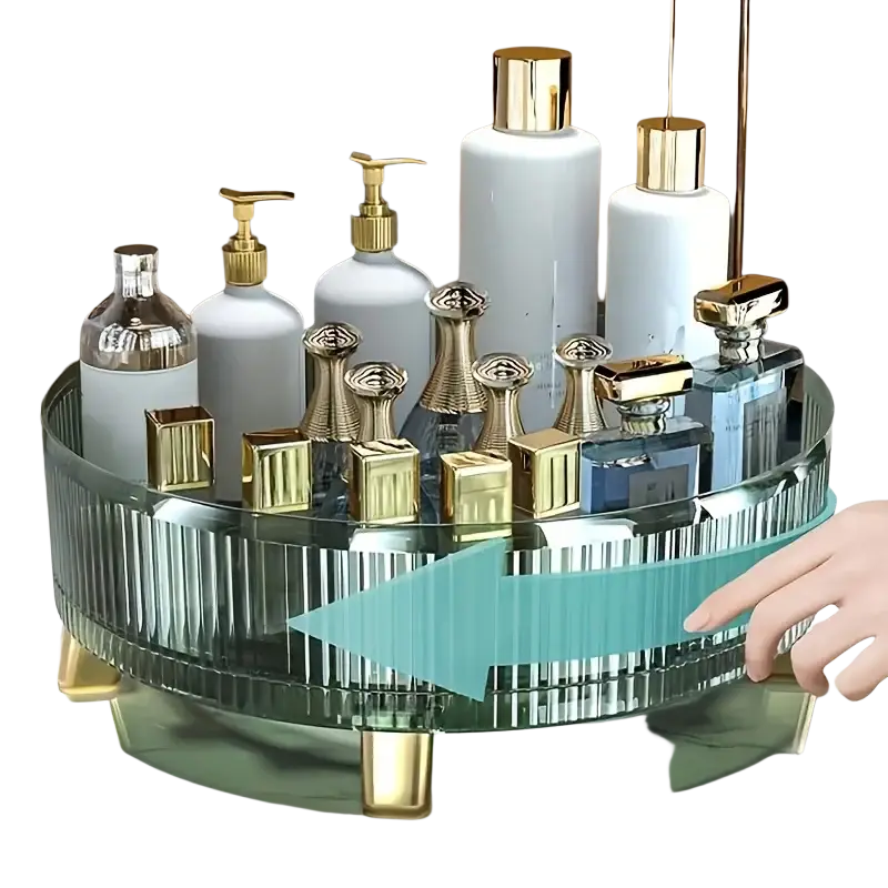 A sleek transparent glass makeup organizer with gold-tone legs and ribbed design holding perfume bottles