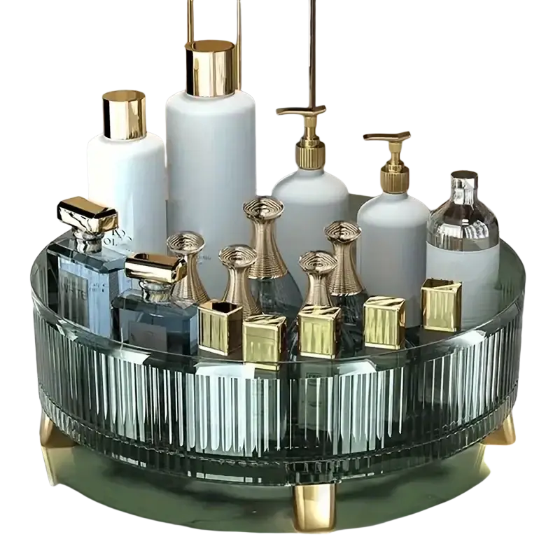 A sleek dark green ribbed glass makeup organizer tray with gold tone legs and a reflective 360 rotating surface