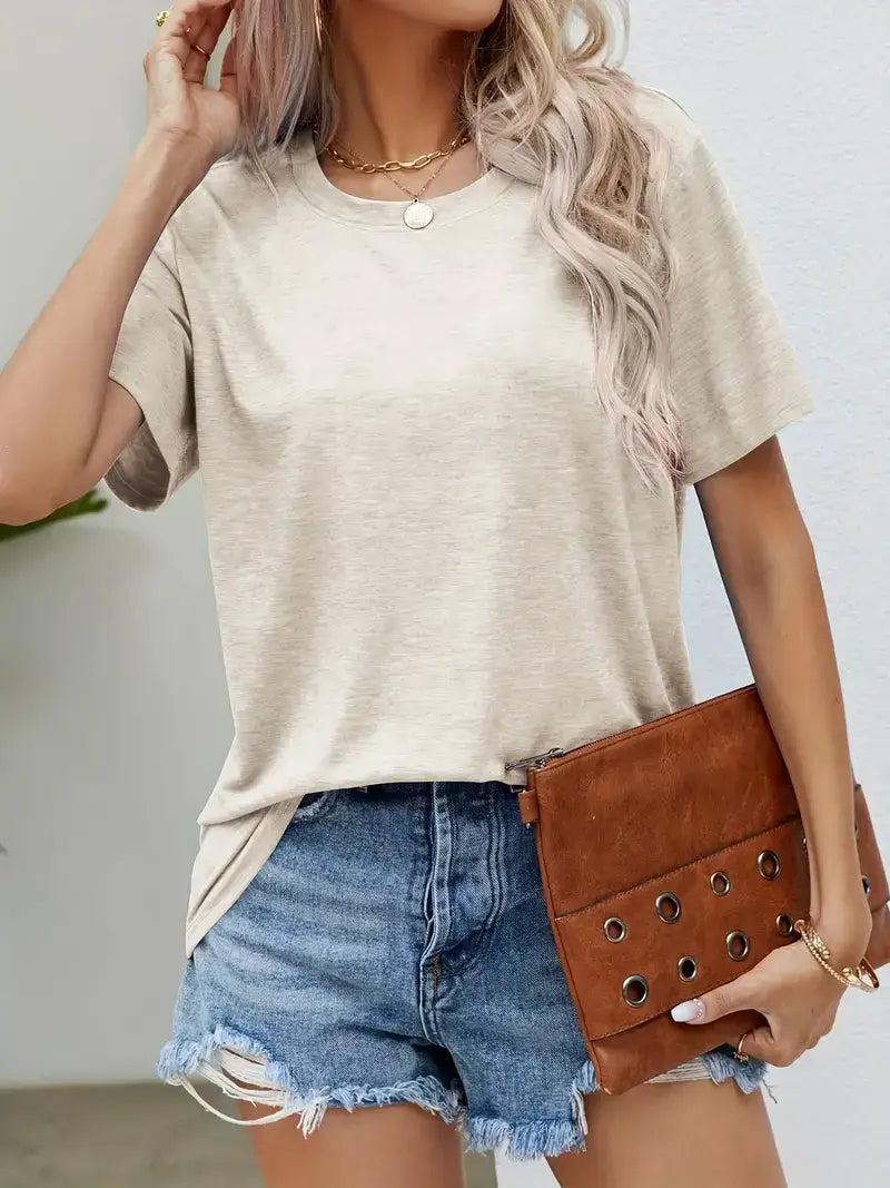 Brown suede clutch with metallic grommets paired with a women’s relaxed fit Korean minimalist cotton t-shirt.