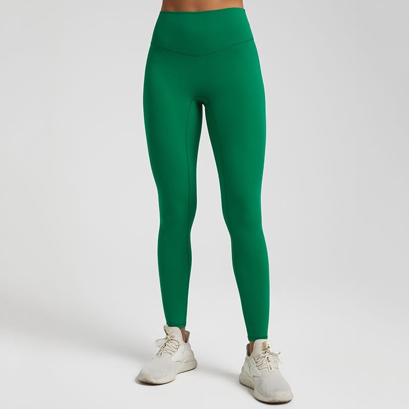Vibrant green high waisted stretch fitted leggings made from stretchy form fitting material.