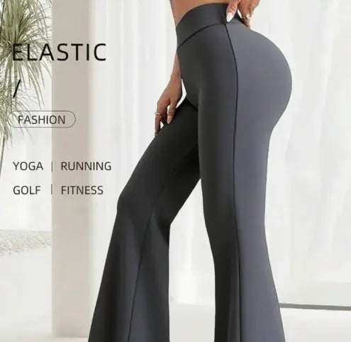 Dark gray high-waisted flare yoga pants with a sleek form-fitting design and subtle side seam detailing.
