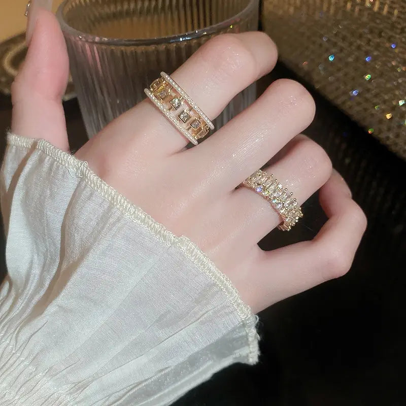 Gold-toned hollowed square pearl and baguette zircon open ring featuring sparkling cubic zirconia stones with a bold and elegant design.