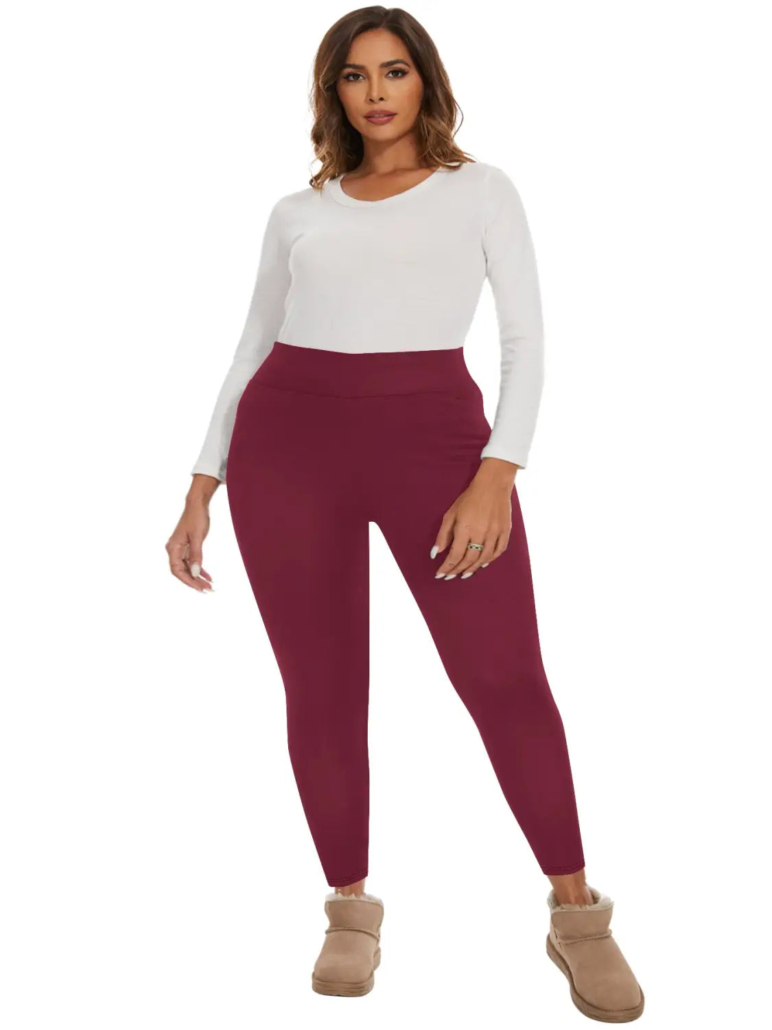A pair of form-fitting solid maroon fleece lined high waisted winter leggings designed for cold weather.