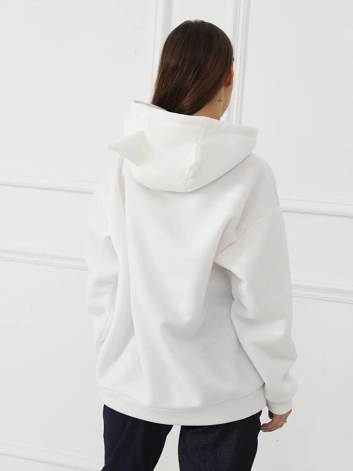 white oversized hoodie with a soft relaxed fit and clean lines featuring a dalmatian print and cat ear hood for women