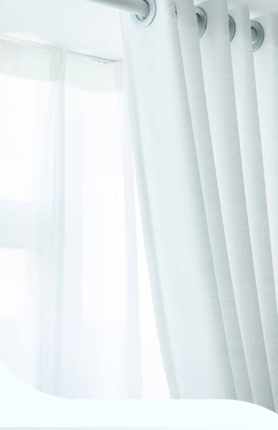 white sheer textured sunscreen linen curtain with grommet top hanging from a rod for home use