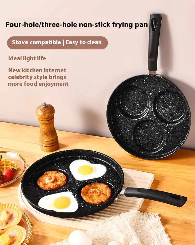 Non-stick heart pancake pan 25cm made of medical stone featuring a black speckled surface with three circular indentations for cooking eggs or pancakes.