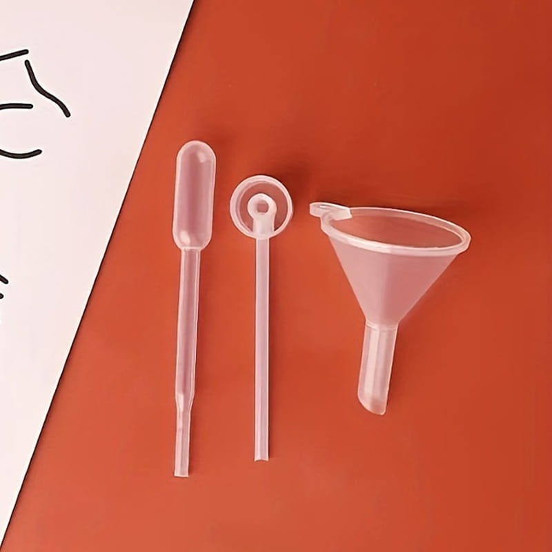 Essential oil dispenser tool set of three transparent plastic mini funnels pipette and dropper for precise liquid transfer.