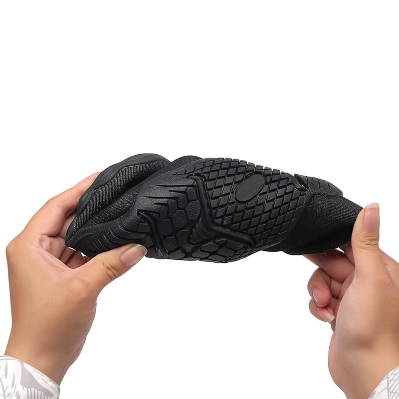 black rubber sole with textured grid pattern and reinforced heel section of breathable non slip mesh water shoes for beach and trekking shown from the back side