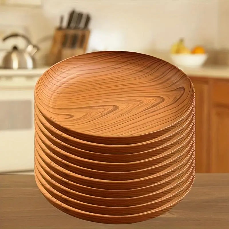 Stack of warm-toned wood grain plastic plates with natural striped patterns in a 10-piece round design.