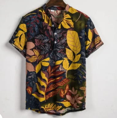 Floral Hawaiian short sleeve shirt for men featuring vibrant tropical leaf patterns in bold yellow orange and green hues on a dark navy background.