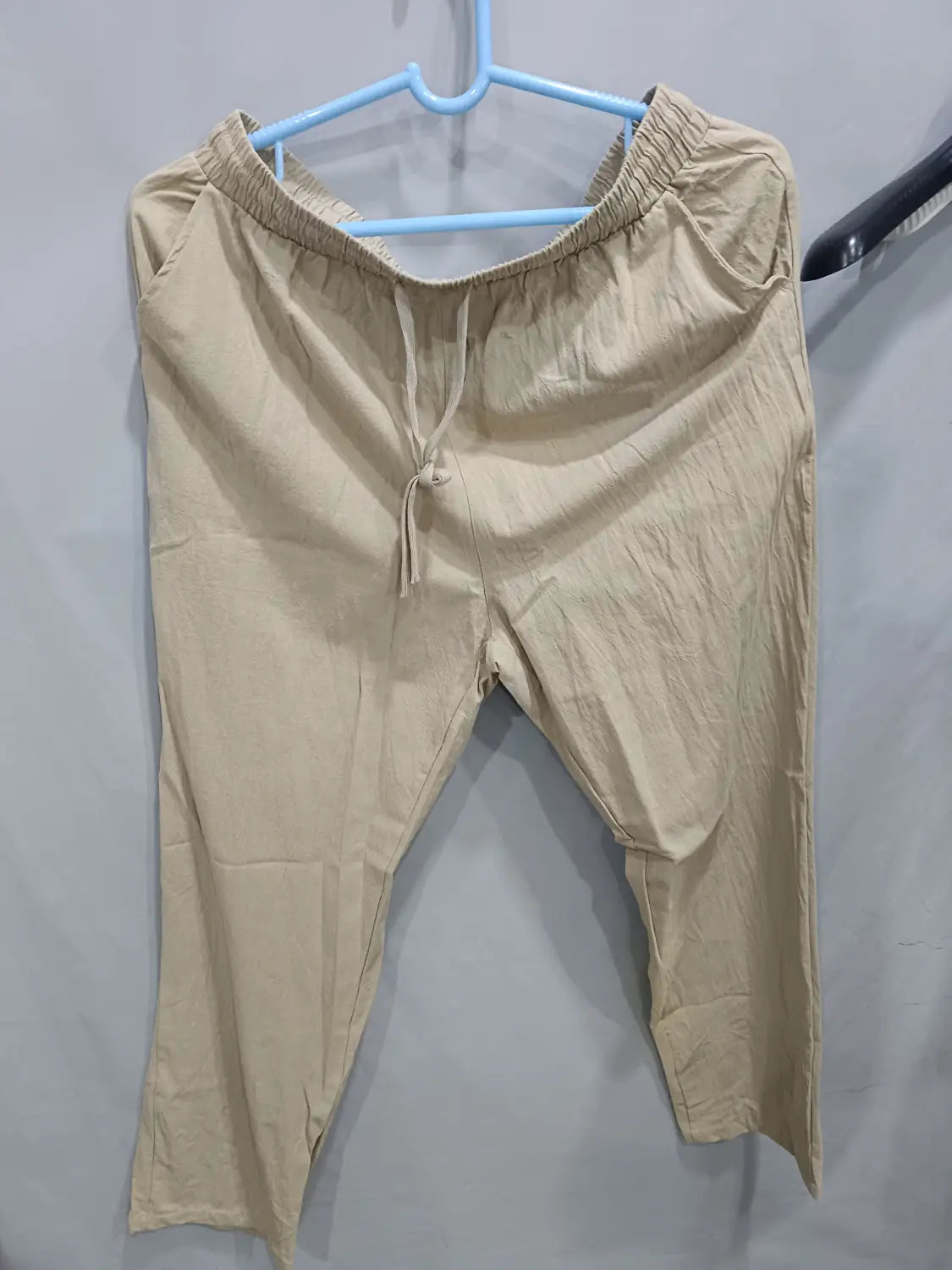 Men’s linen joggers casual drawstring pants in beige cotton with an elastic waistband and relaxed fit.