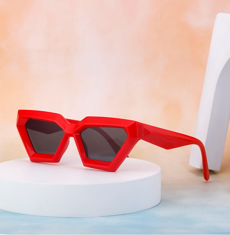 Vibrant red modern irregular cat eye geometric sunglasses with uv400 dark gray lenses designed for stylish sun protection.