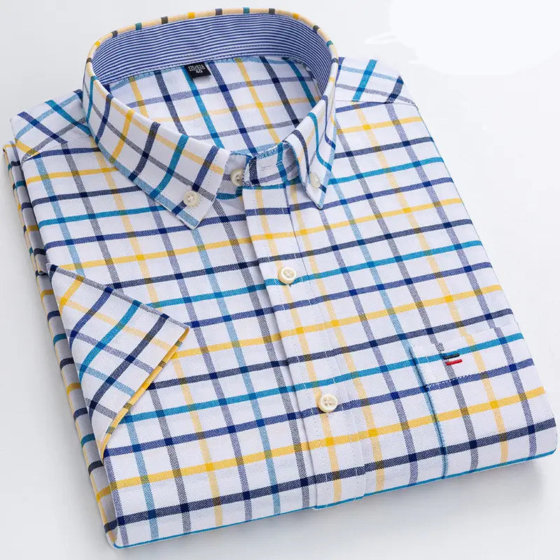 Men’s premium 100% cotton textured short sleeve shirt featuring a crisp button-down design with a vibrant blue and yellow plaid pattern on a white base fabric.