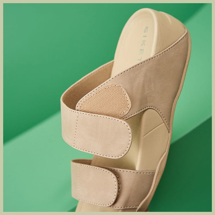 Beige suede women’s platform sport sandals with cushioned insole and two velcro slide-on straps.